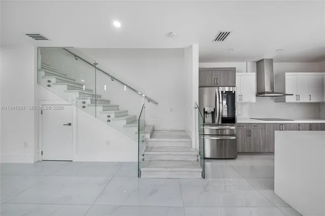 a view of entryway and hall with a window