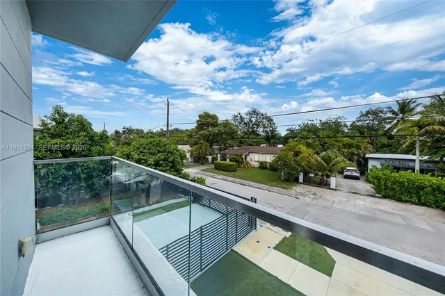 a view of balcony with furniture