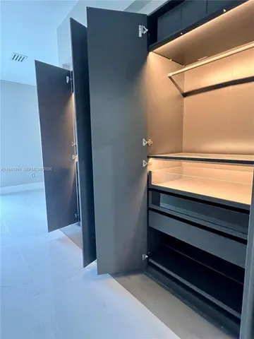 a view of an empty room and window