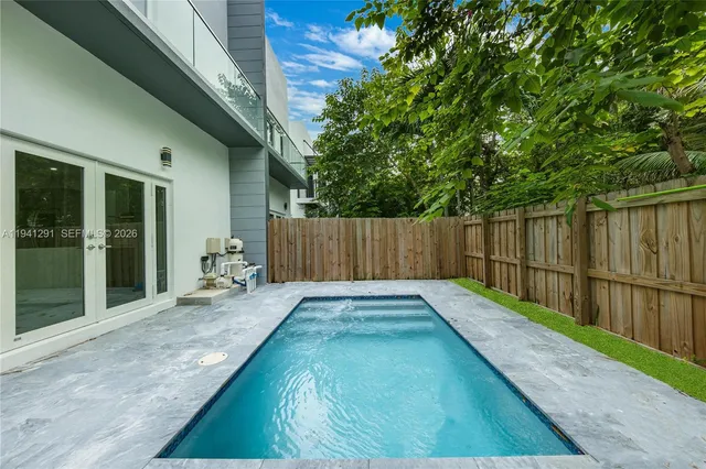 a view of a backyard with a patio