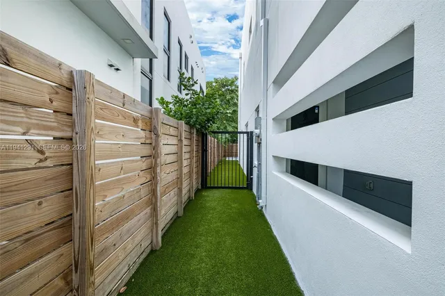 a view of a hallway with stairs