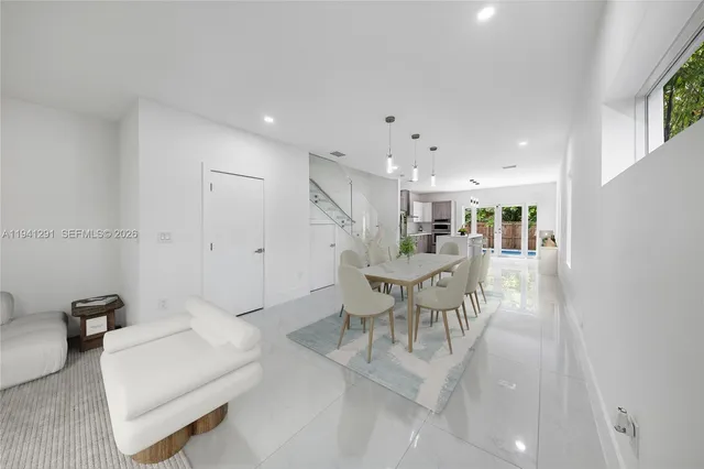 a view of a kitchen with furniture and windows