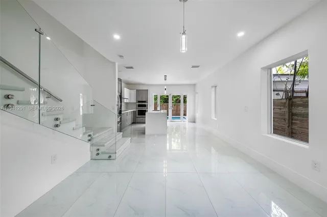 a view of kitchen with furniture and window