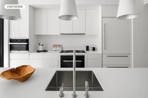 a kitchen with granite countertop a cabinets and a stove