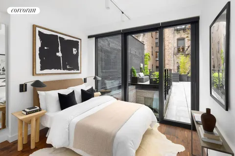a bedroom with a large bed and a large window
