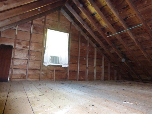 58 Ronald Road Arlington, MA 02474 - Photo 15 of 18 a view of a room with wooden walls and windows