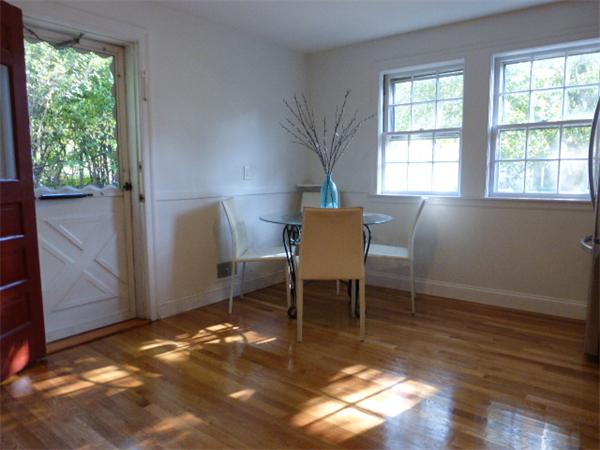 58 Ronald Road Arlington, MA 02474 - Photo 3 of 18 a view of a dining room with furniture window and wooden floor