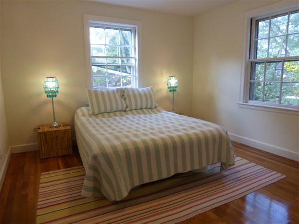 58 Ronald Road Arlington, MA 02474 - Photo 9 of 18 a bedroom with a bed and wooden floor