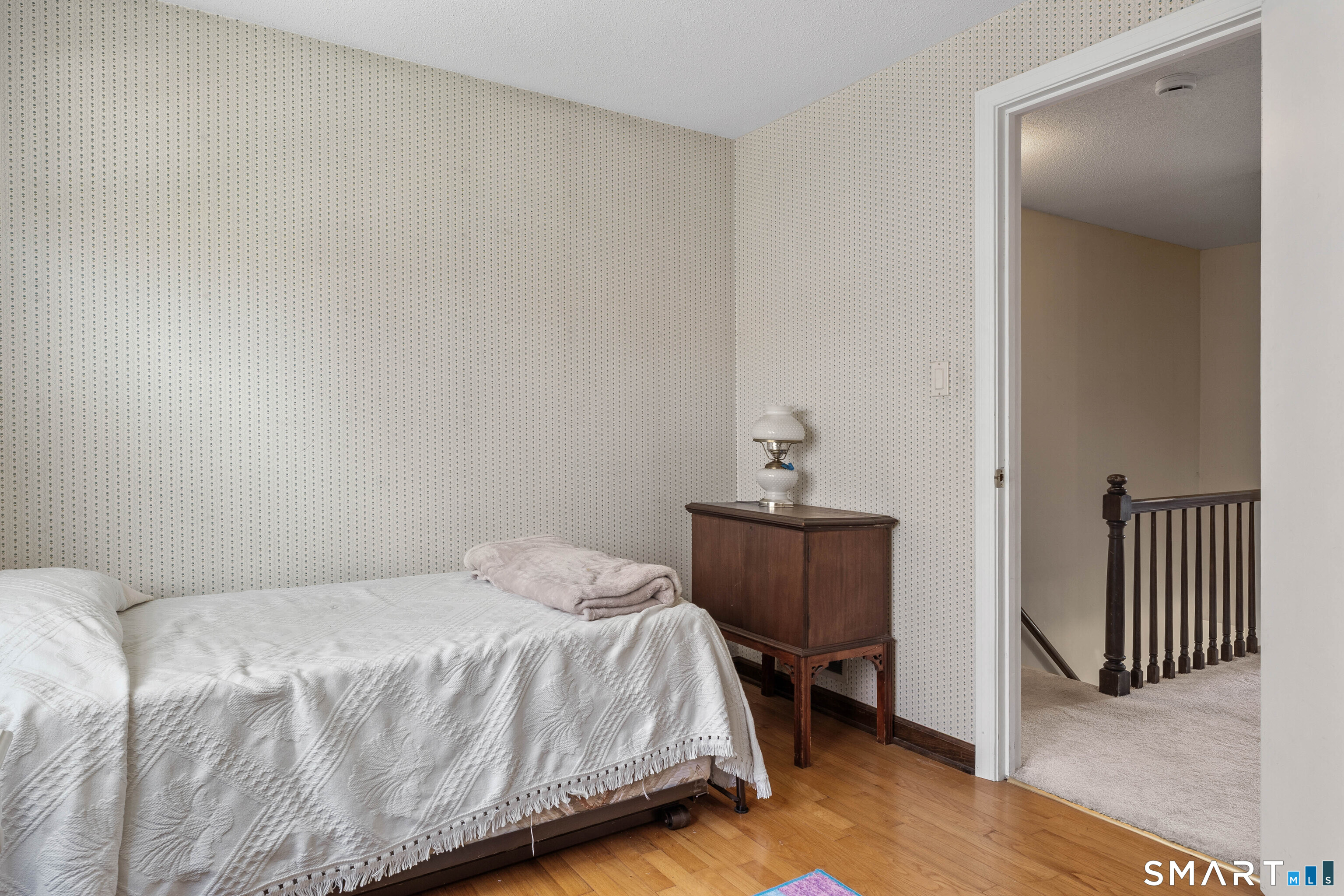 26 Seiter Hill Road Wallingford, CT 06492 - Photo 11 of 21 a bedroom with a bed and a chair