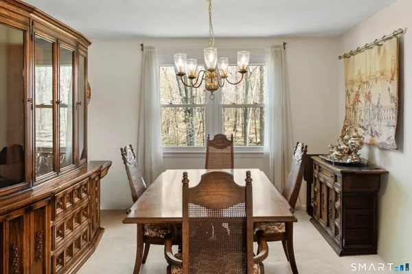 a view of a dining room with furniture window and outside view