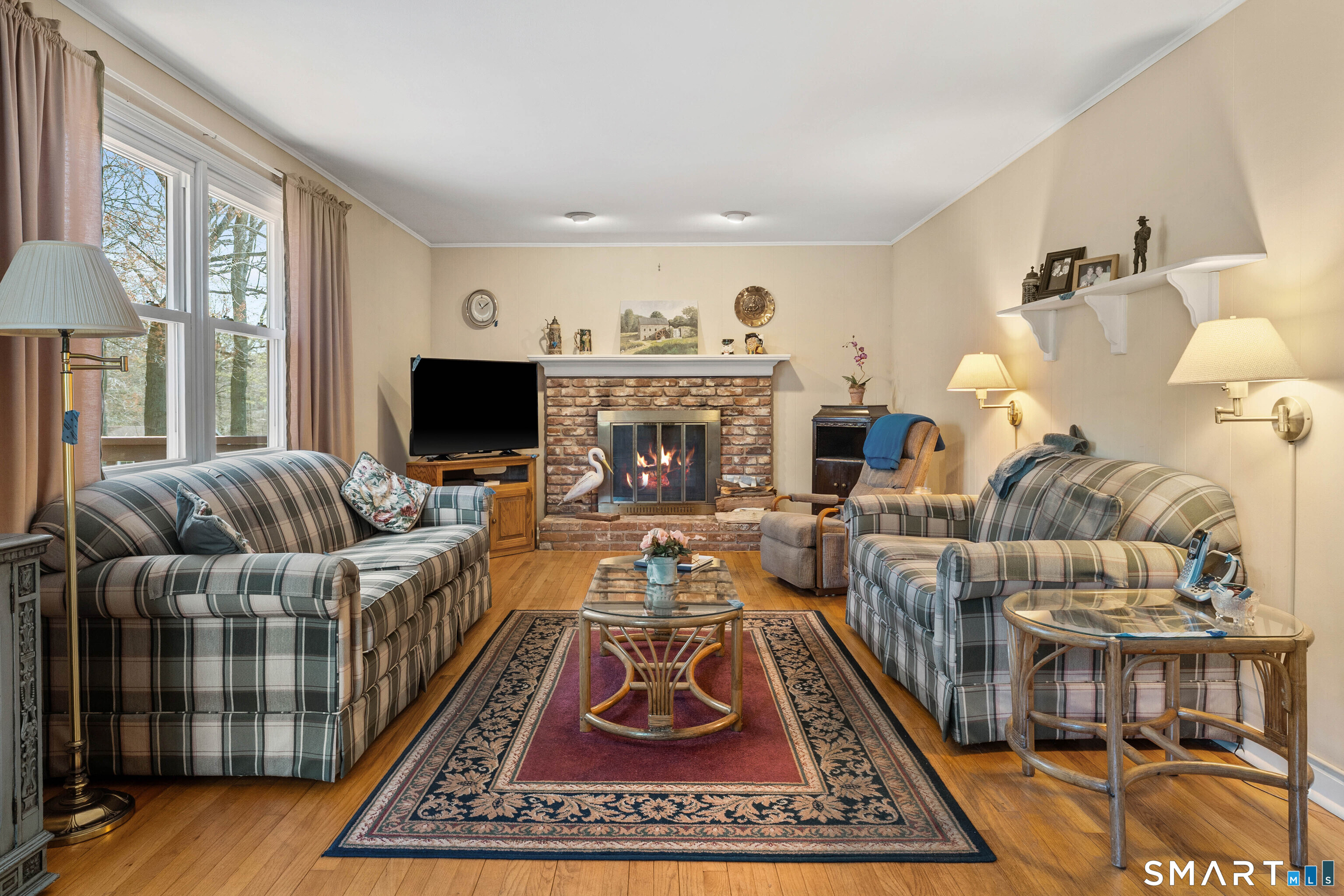 26 Seiter Hill Road Wallingford, CT 06492 - Photo 19 of 21 a living room with furniture a rug and a fireplace