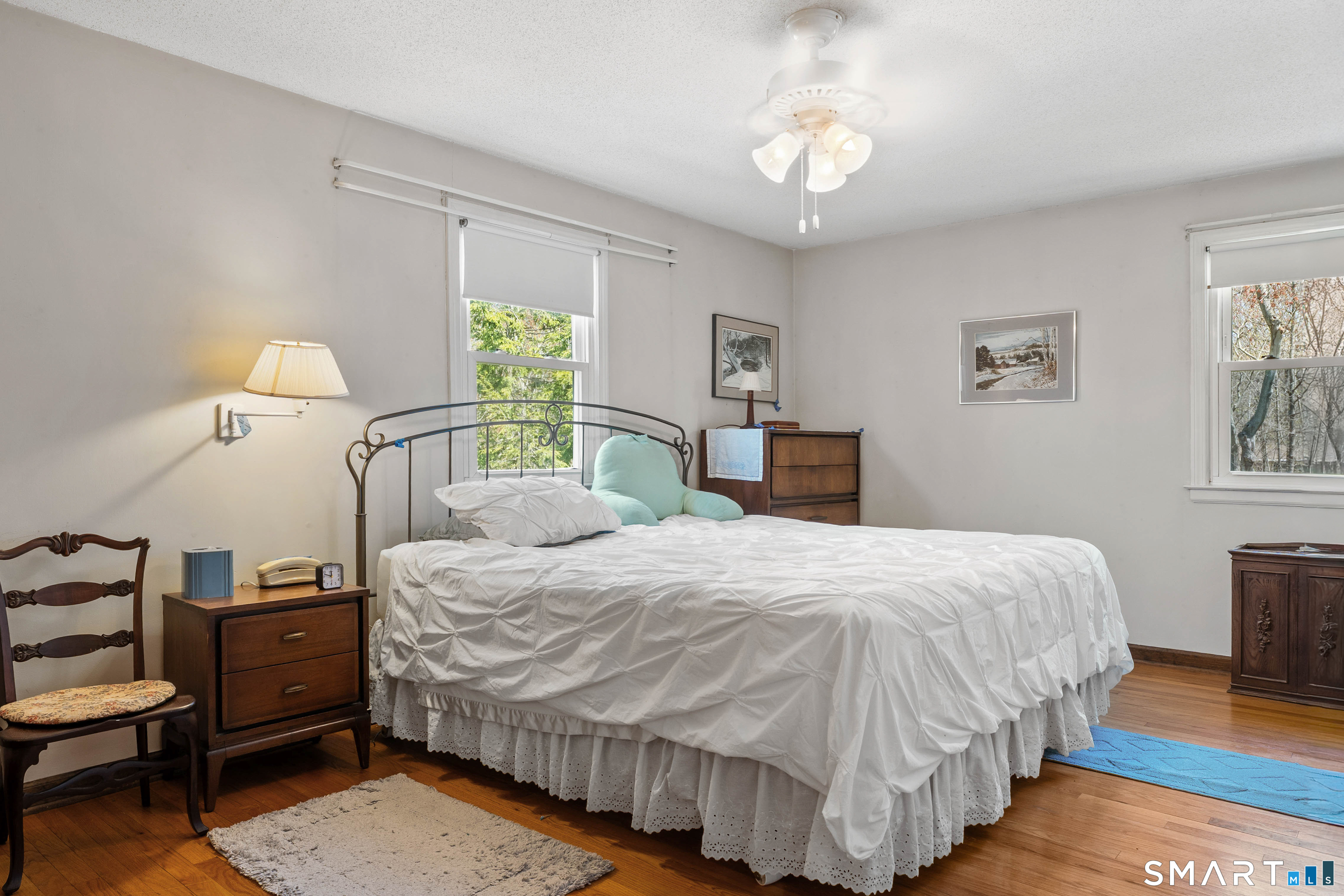 26 Seiter Hill Road Wallingford, CT 06492 - Photo 5 of 21 a bedroom with a bed and a chandelier