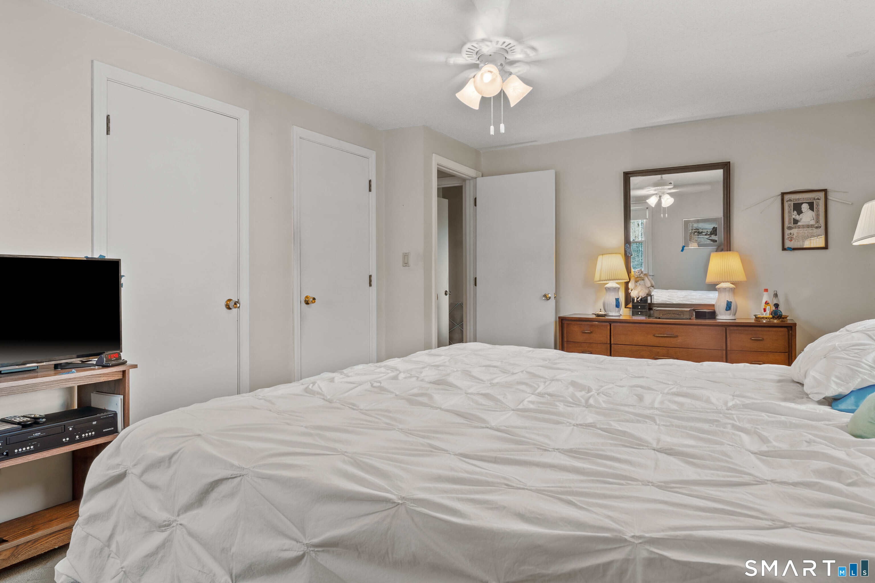 26 Seiter Hill Road Wallingford, CT 06492 - Photo 6 of 21 a bedroom with a bed and a flat screen tv