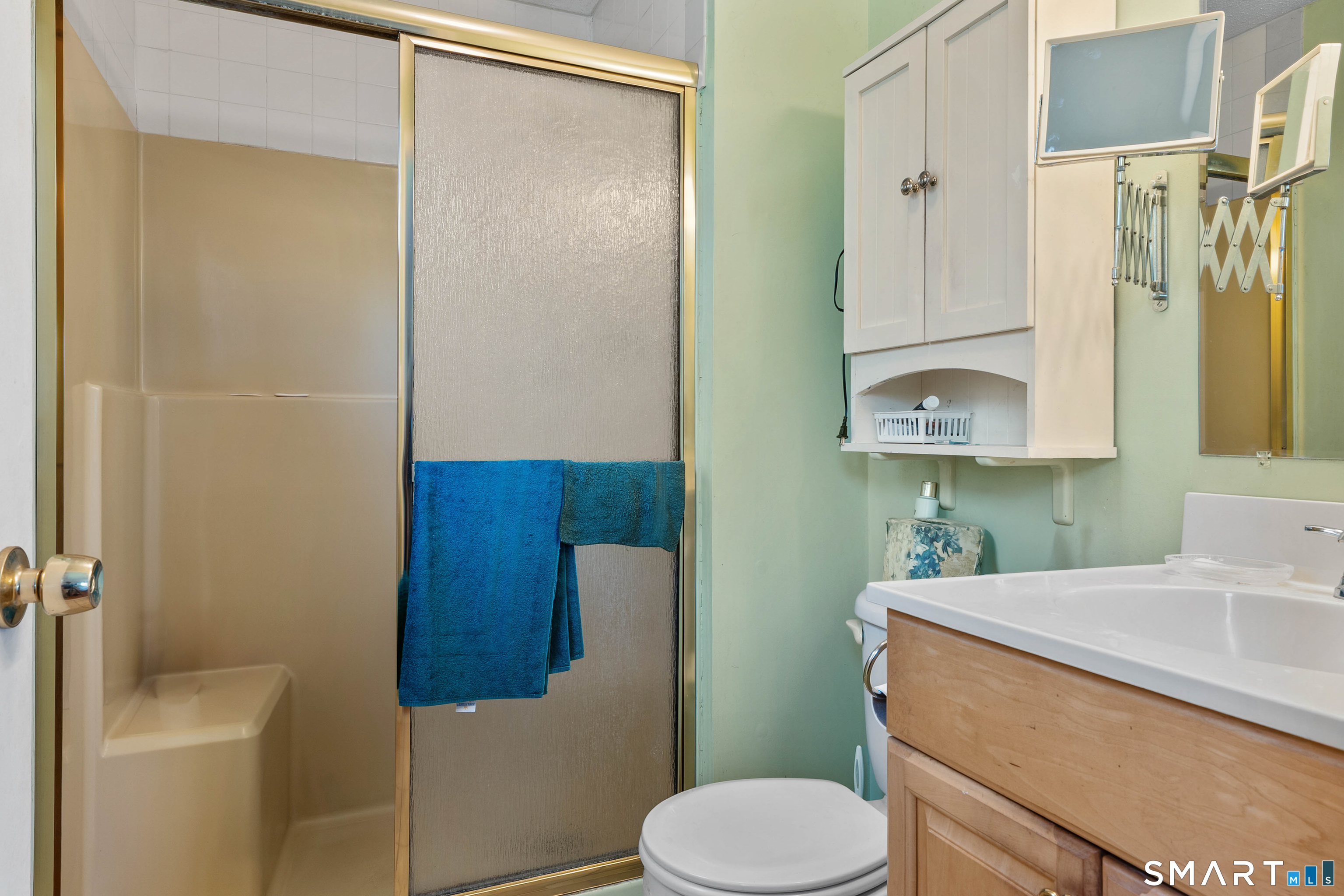 26 Seiter Hill Road Wallingford, CT 06492 - Photo 7 of 21 a bathroom with a sink a toilet and shower