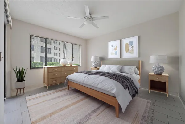 a bed room with a bed and a large window