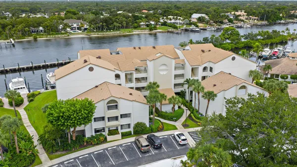 an aerial view of a house with a lake view