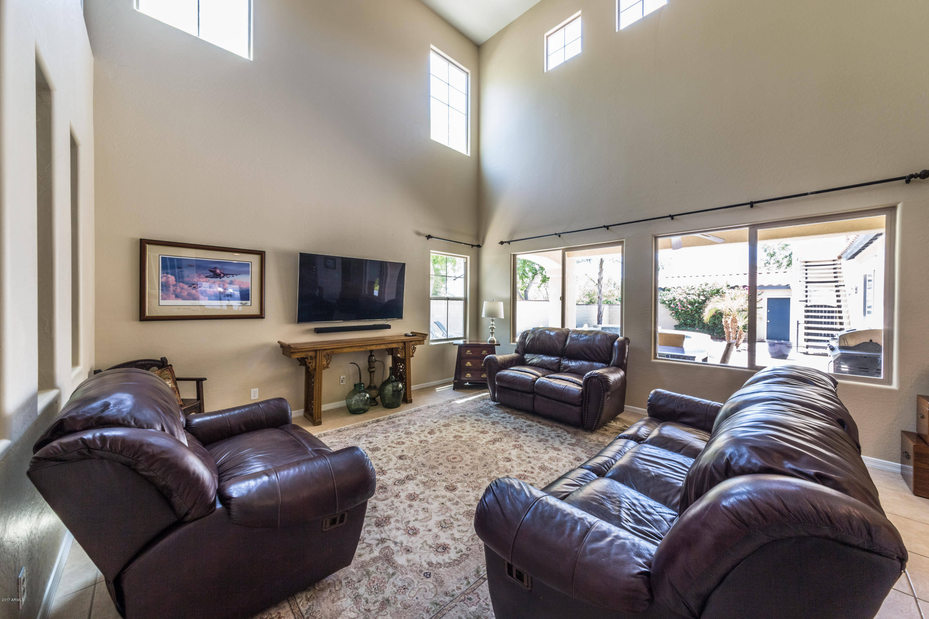 2872 North Point Ridge Road Buckeye, AZ 85396 - Photo 14 of 36 a living room with furniture and a flat screen tv