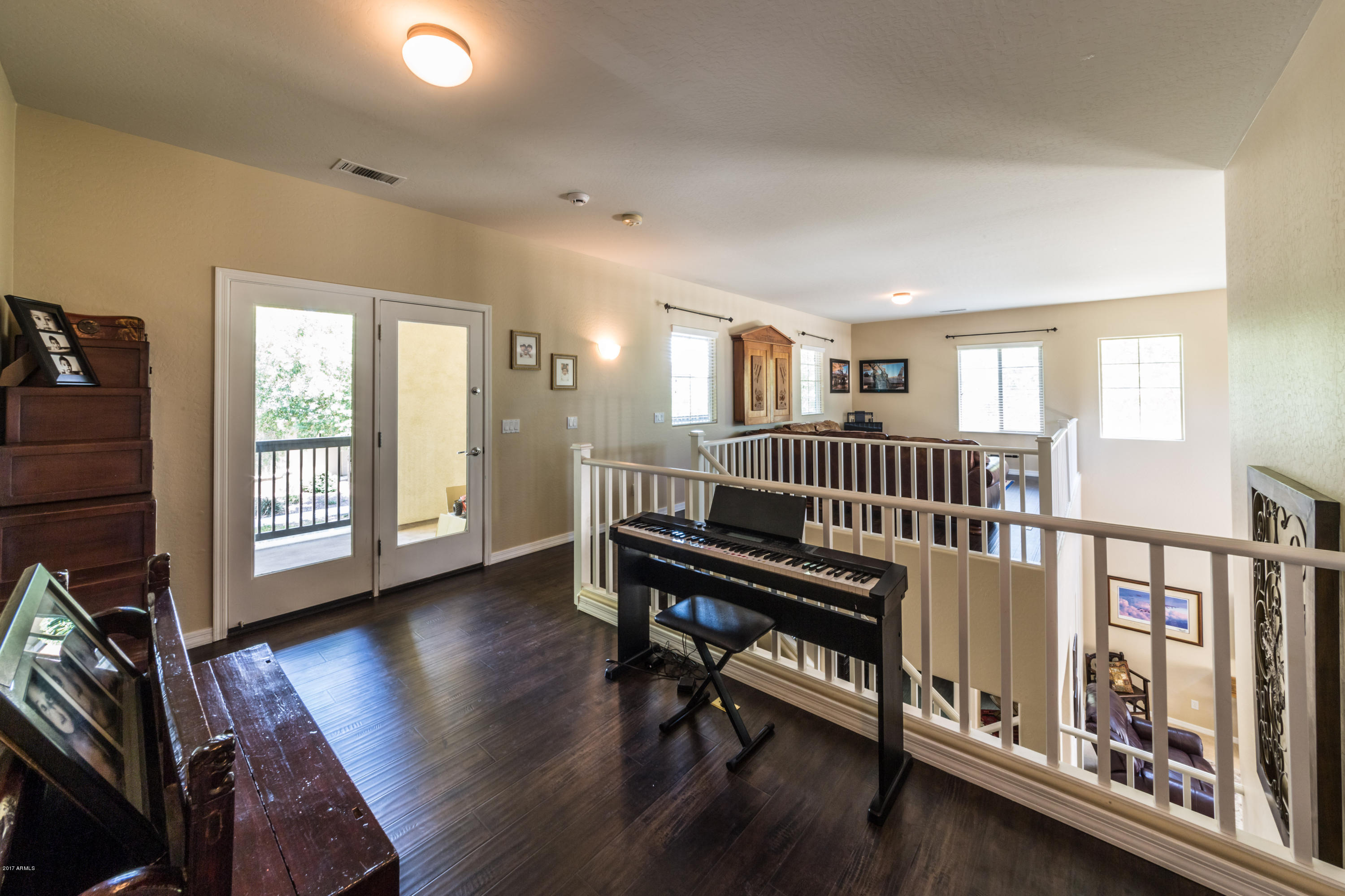 2872 North Point Ridge Road Buckeye, AZ 85396 - Photo 20 of 36 a bedroom with furniture and a window