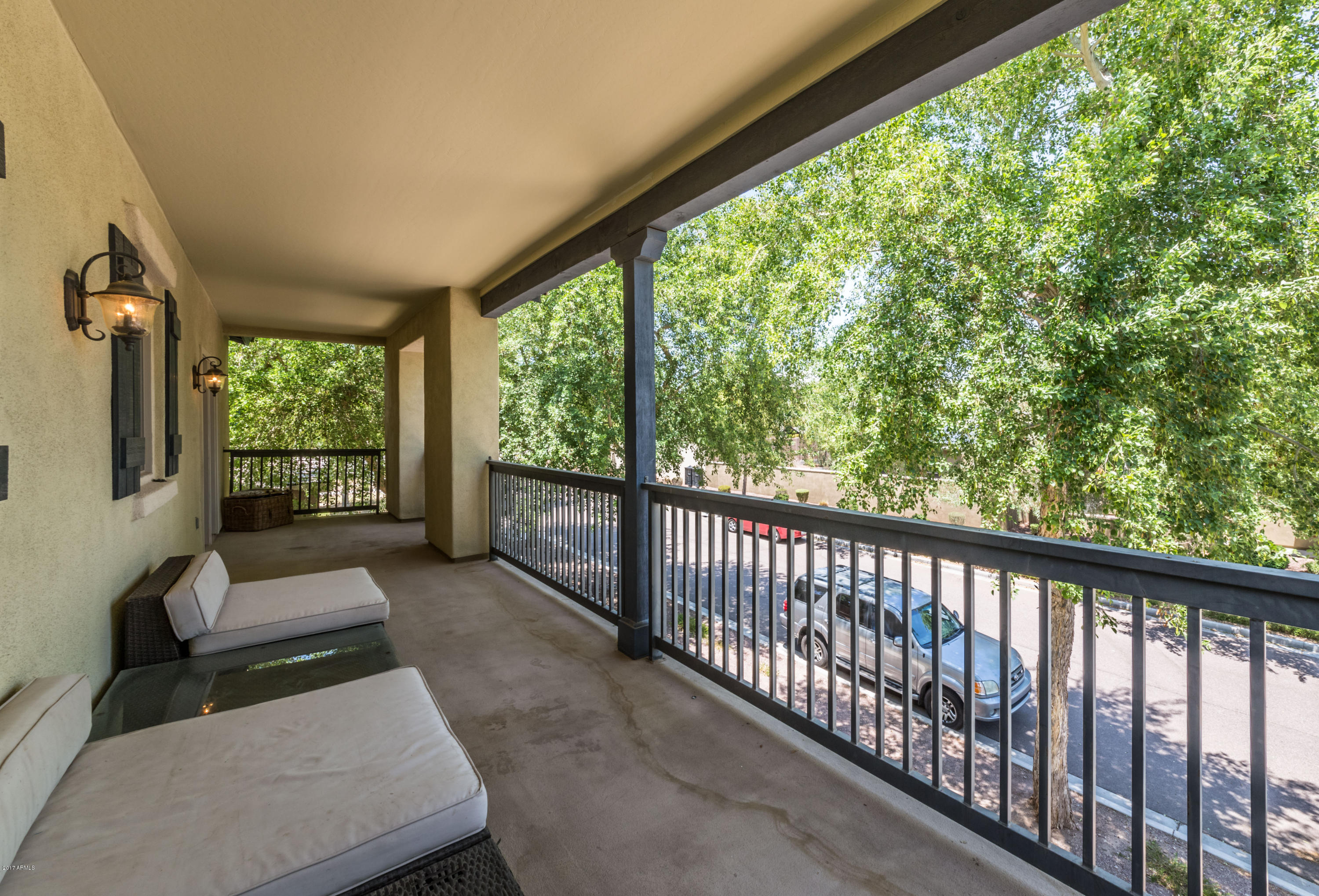 2872 North Point Ridge Road Buckeye, AZ 85396 - Photo 25 of 36 a view of a porch with furniture and floor to ceiling window