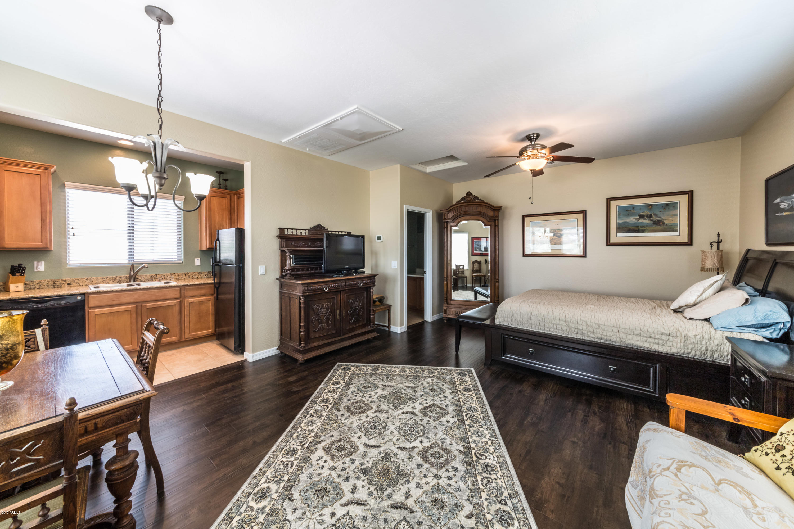 2872 North Point Ridge Road Buckeye, AZ 85396 - Photo 27 of 36 a bedroom with furniture and a wooden floor
