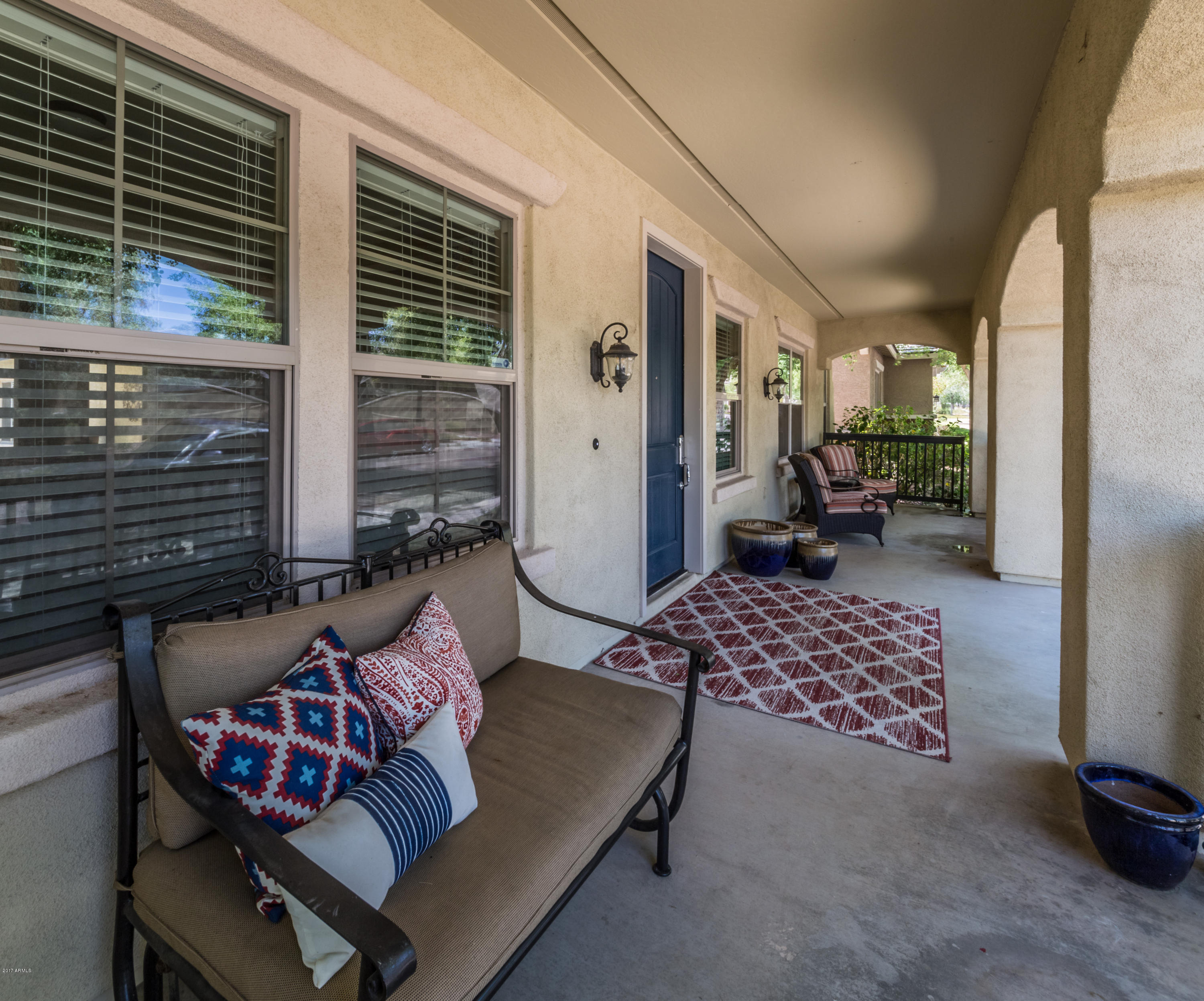2872 North Point Ridge Road Buckeye, AZ 85396 - Photo 3 of 36 a outdoor living space with furniture and a potted plant