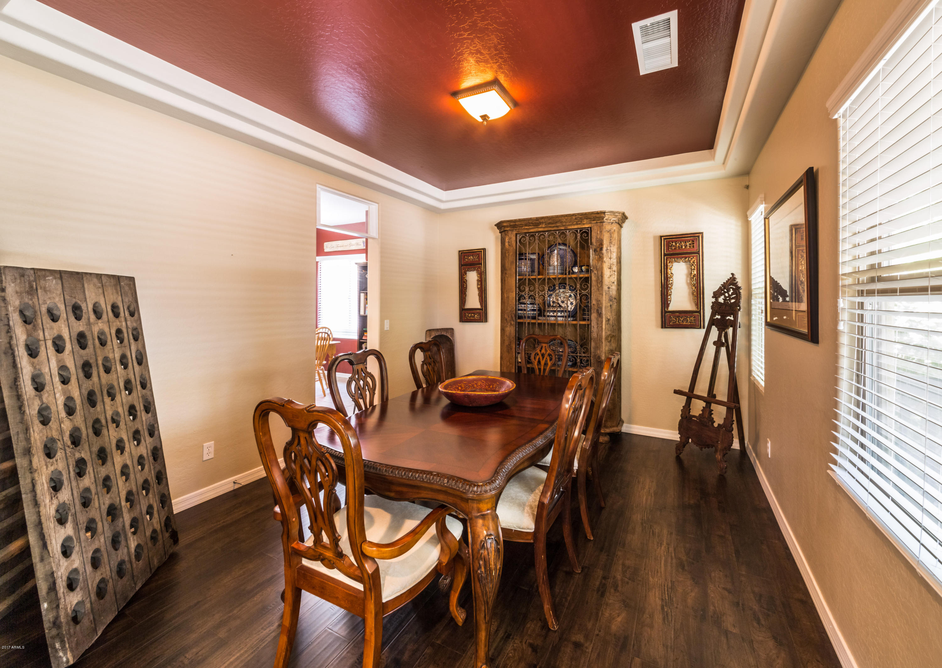 2872 North Point Ridge Road Buckeye, AZ 85396 - Photo 6 of 36 a view of a dining room with furniture and wooden floor