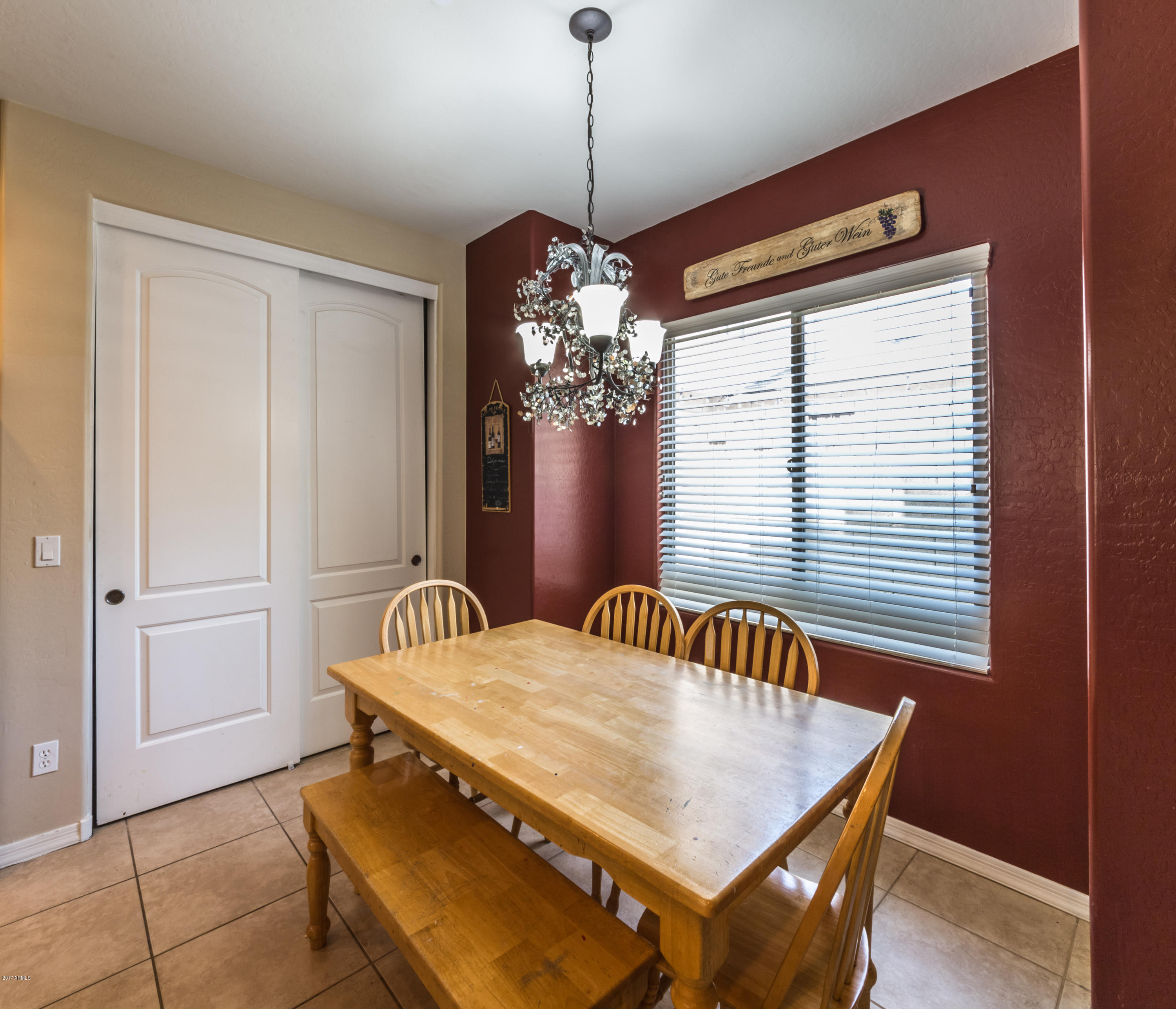 2872 North Point Ridge Road Buckeye, AZ 85396 - Photo 8 of 36 a dining room with furniture and window