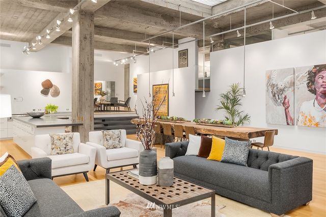 a living room with furniture and a table