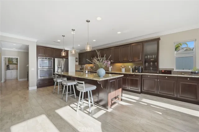 a kitchen with a table and chairs in it
