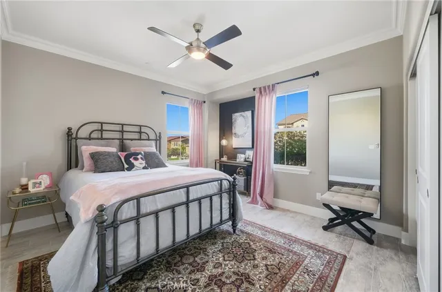 a bedroom with a bed a desk and chair