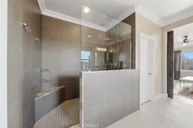 a bathroom with a tub shower sink and mirror