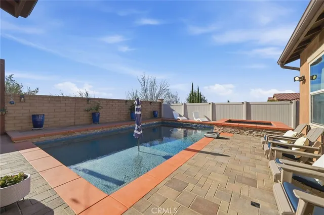 a view of a patio with swimming pool