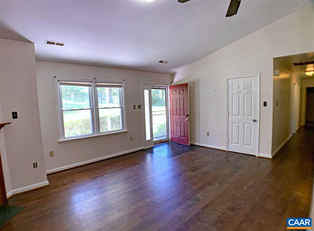 731 Geranium Road Ruckersville, VA 22968 - Photo 3 of 27 an empty room with wooden floor and windows