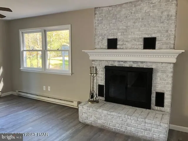 a living room with a fireplace and a table