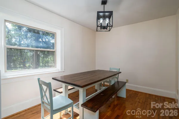 a living room with furniture and a ceiling fan
