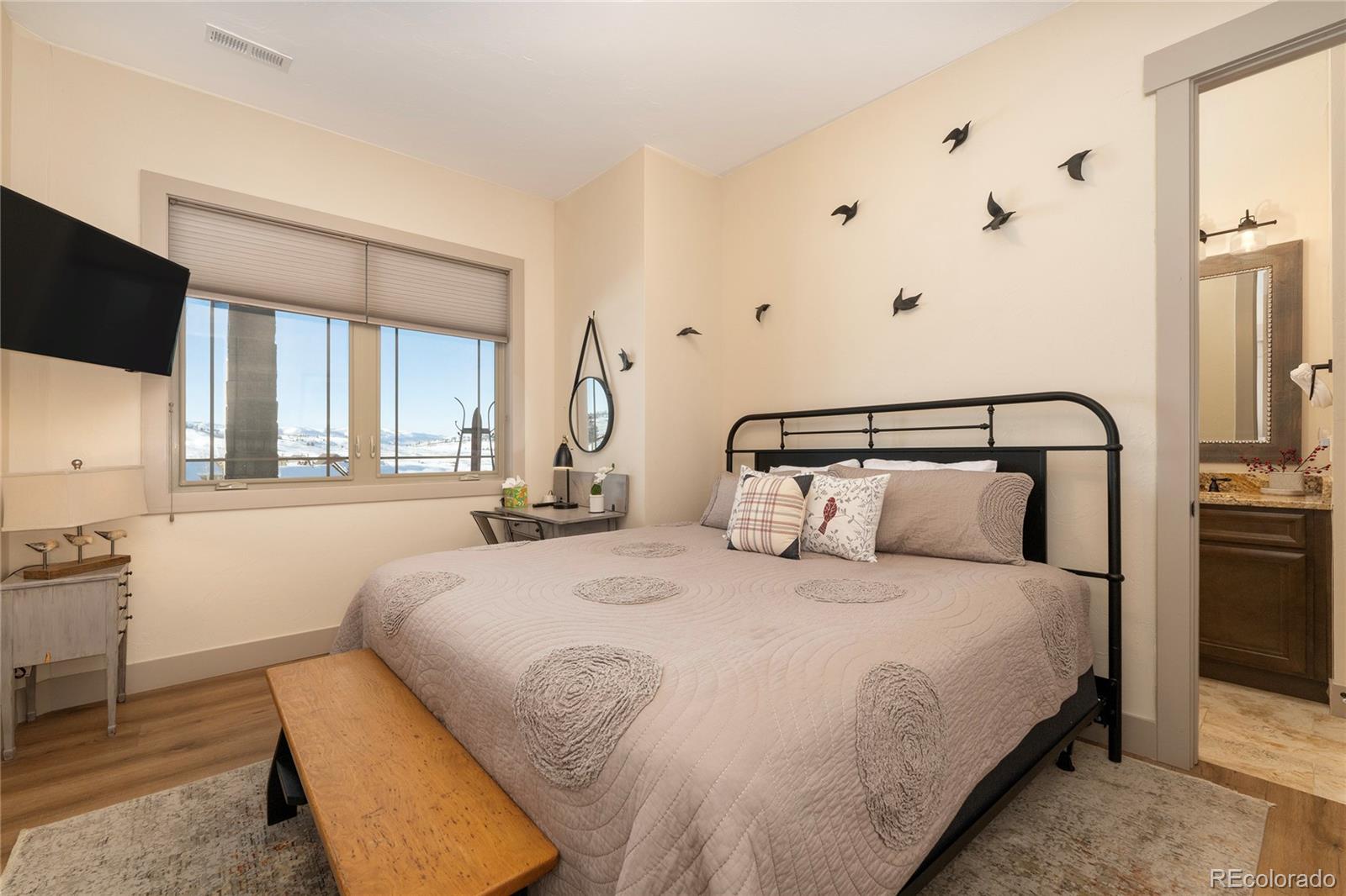 465 Lower Ranch View Drive Granby, CO 80446 - Photo 38 of 50 a bedroom with a bed and window