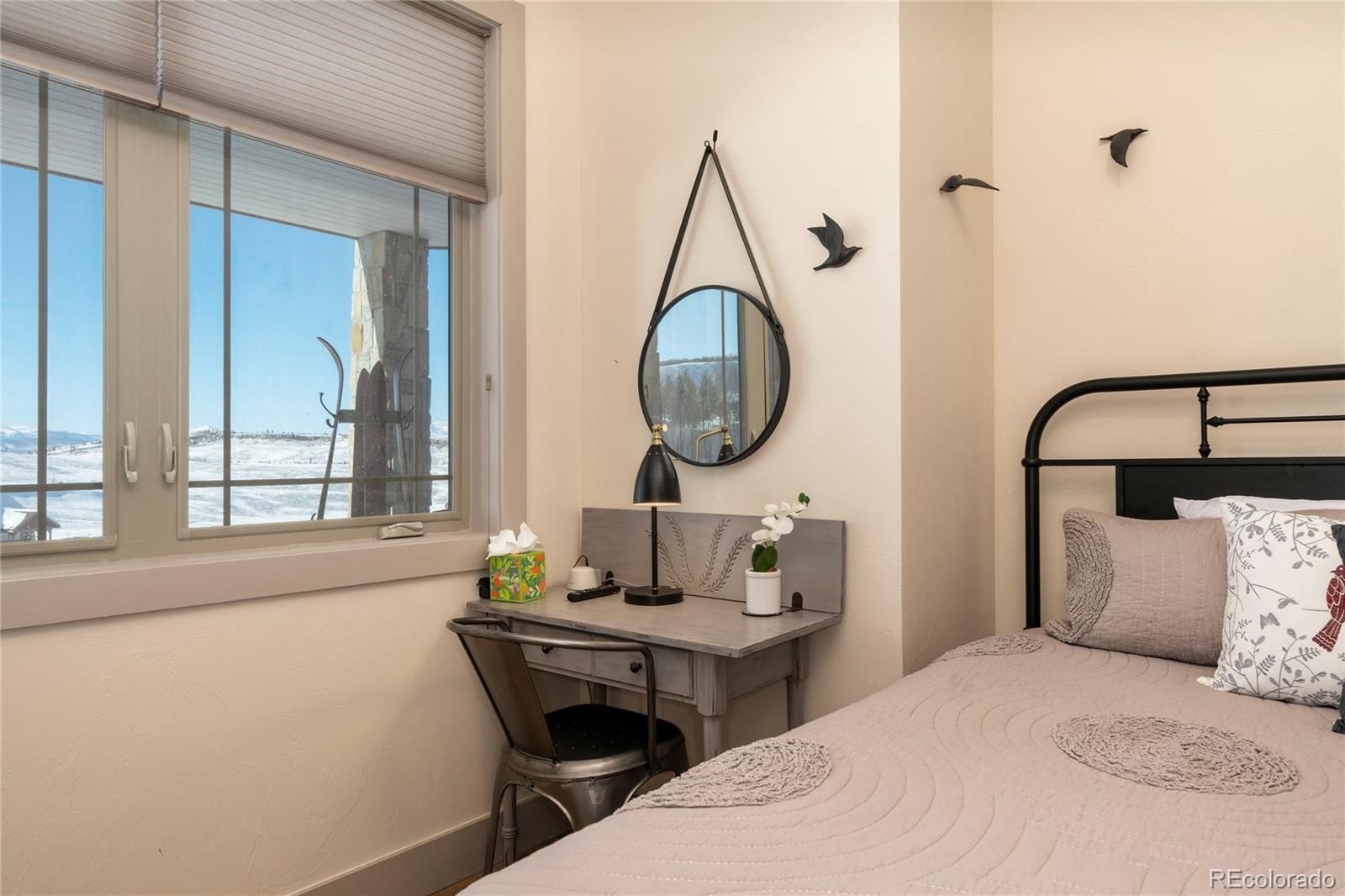 465 Lower Ranch View Drive Granby, CO 80446 - Photo 39 of 50 a bedroom with a bed and a window