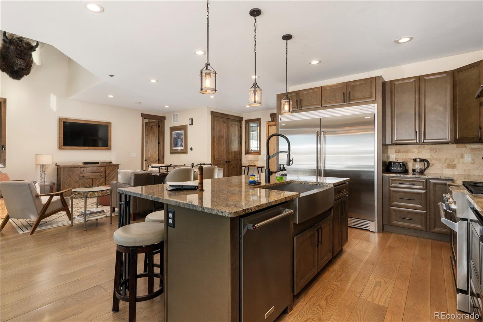 465 Lower Ranch View Drive Granby, CO 80446 - Photo 4 of 50 a kitchen with stainless steel appliances granite countertop a sink a stove and a refrigerator