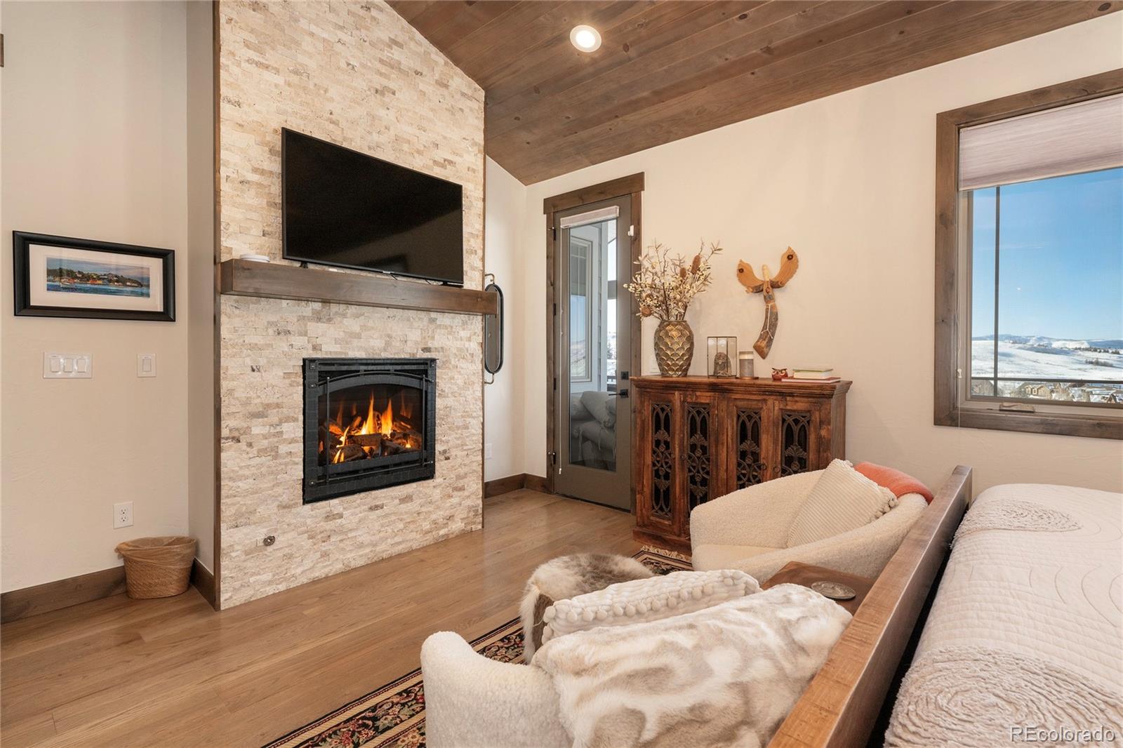 465 Lower Ranch View Drive Granby, CO 80446 - Photo 45 of 50 a living room with furniture a flat screen tv and a fireplace