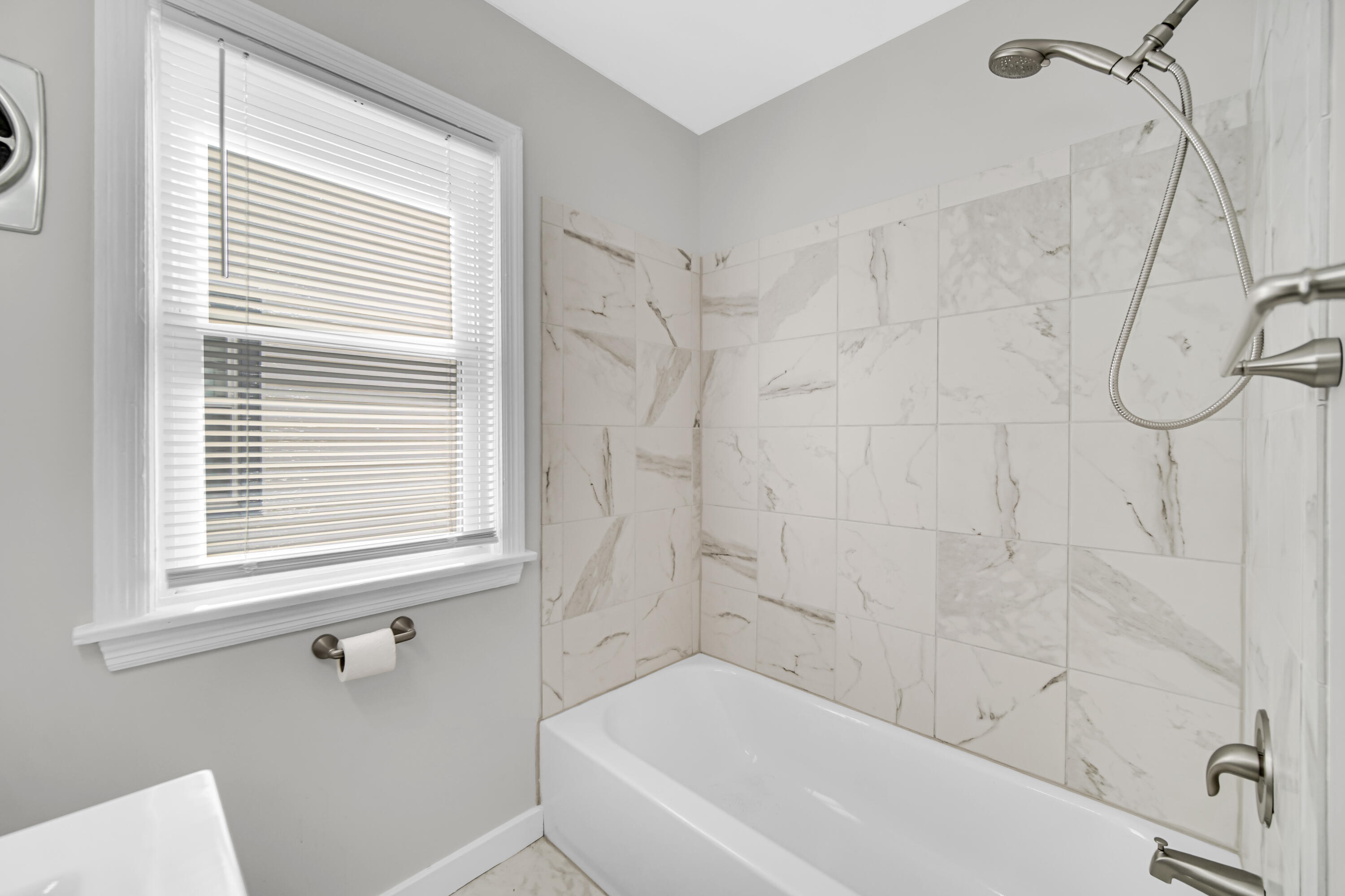 2726 162nd Place Hammond, IN 46323 - Photo 10 of 18 a bathroom with a bathtub and shower