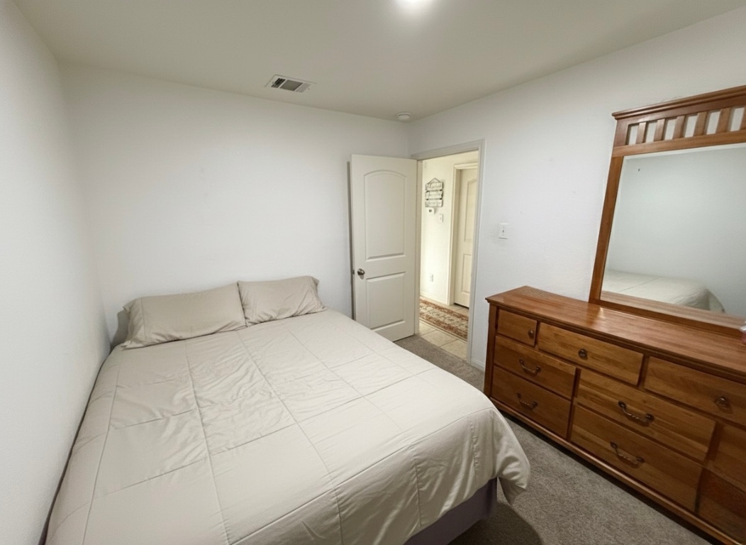 108 Koontz Loop Jarrell, TX 76537 - Photo 13 of 20 View of carpeted bedroom