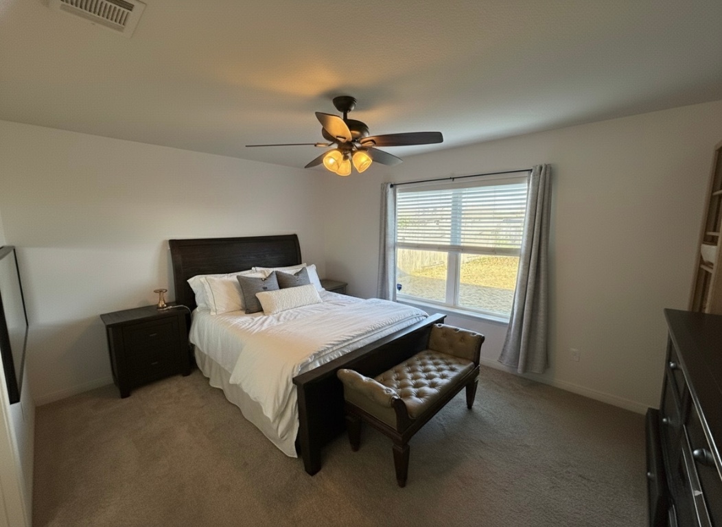 108 Koontz Loop Jarrell, TX 76537 - Photo 15 of 20 Bedroom featuring carpet and a ceiling fan