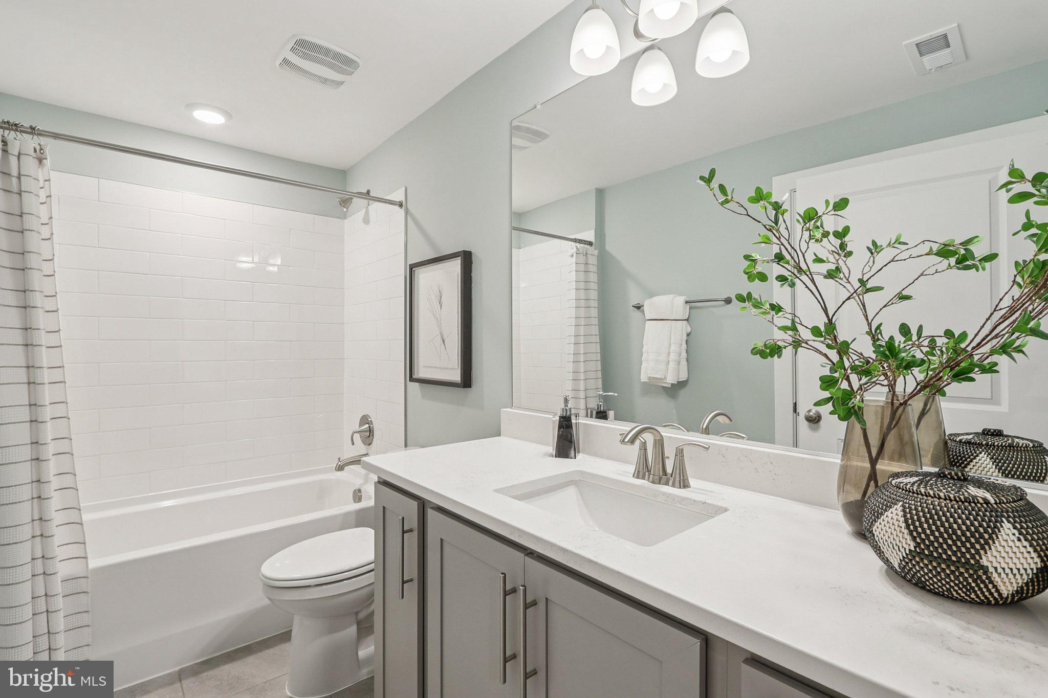 121 Hydrangea Way Winchester, VA 22602 - Photo 53 of 83 a bathroom with a granite countertop sink a toilet and shower