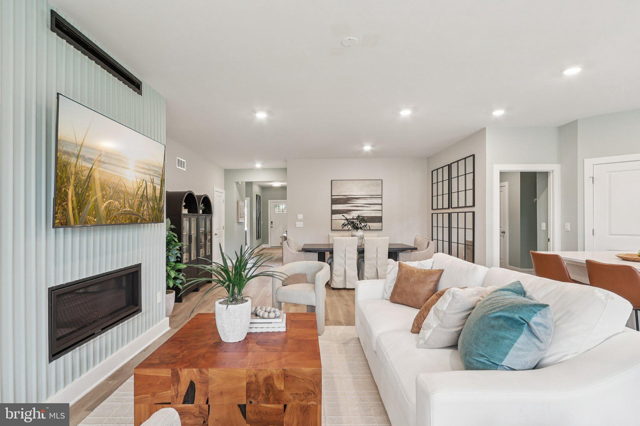 121 Hydrangea Way Winchester, VA 22602 - Photo 9 of 83 a living room with furniture fireplace and potted plant