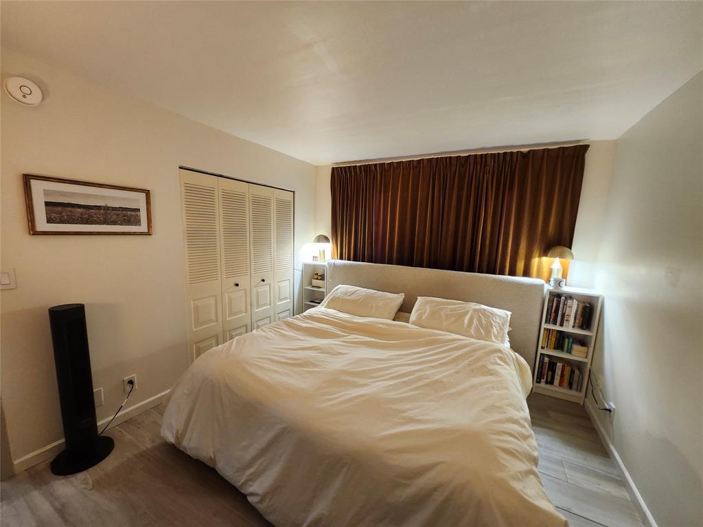 10004 Winding Lake Road, Unit 101 Sunrise, FL 33351 - Photo 13 of 17 a large white bed in a white room