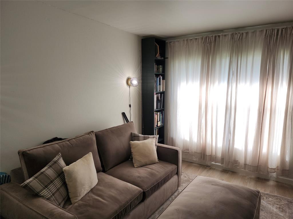 10004 Winding Lake Road, Unit 101 Sunrise, FL 33351 - Photo 4 of 17 a living room with furniture and a area