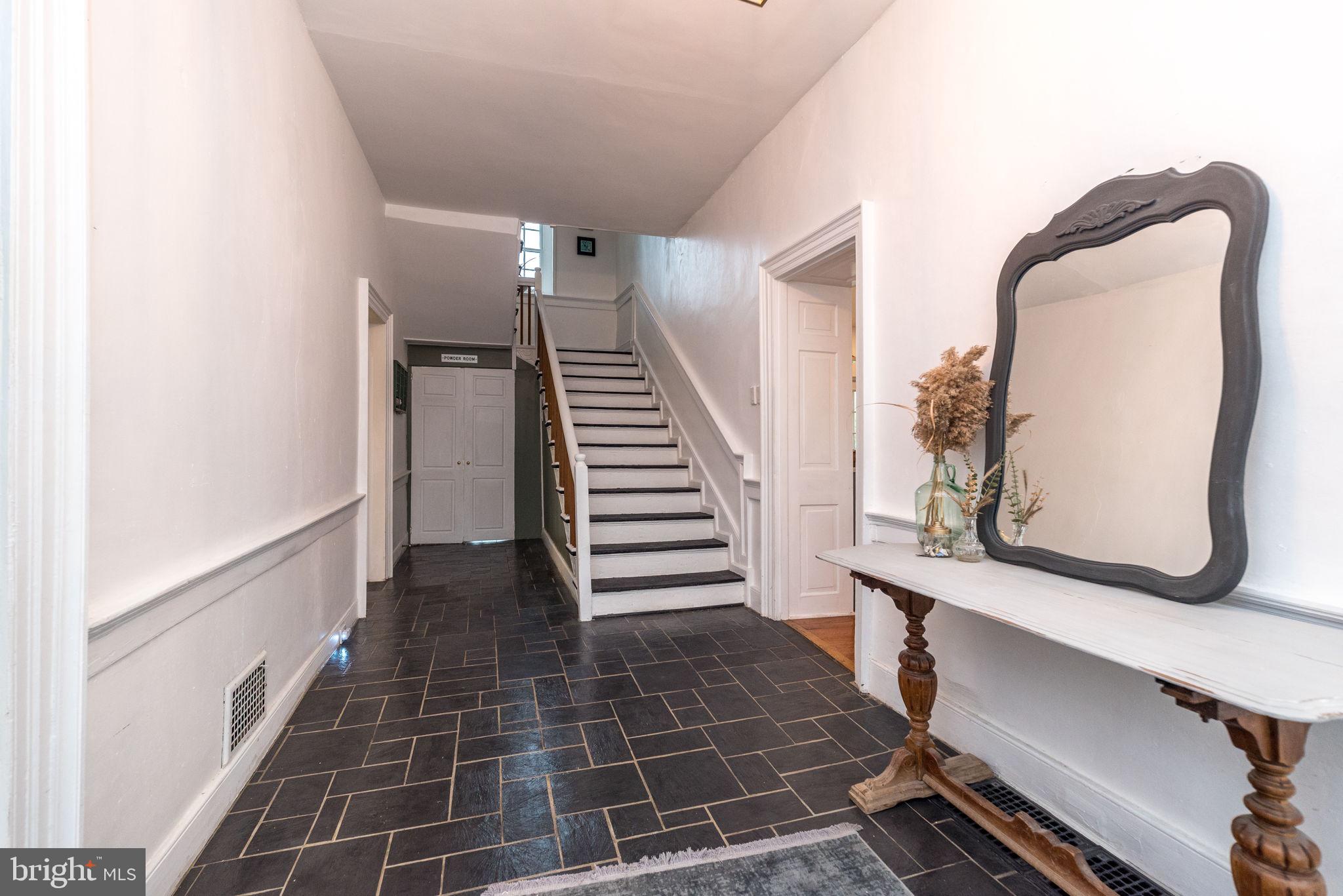 866 Schuylkill Road Birdsboro, PA 19508 - Photo 12 of 73 a view of a hallway with wooden floor and a bathroom