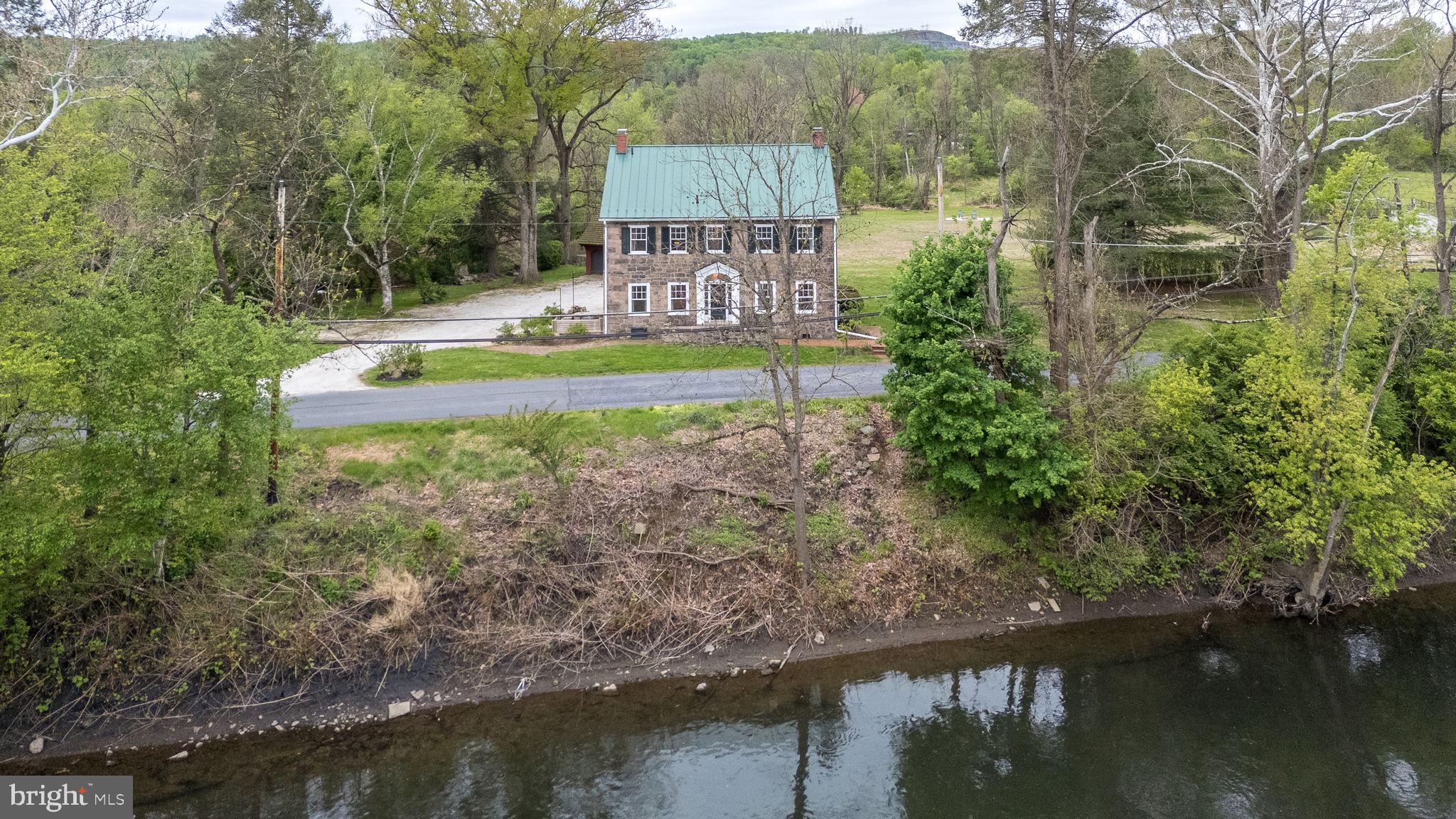 866 Schuylkill Road Birdsboro, PA 19508 - Photo 3 of 73 a view of a lake with a house in the background