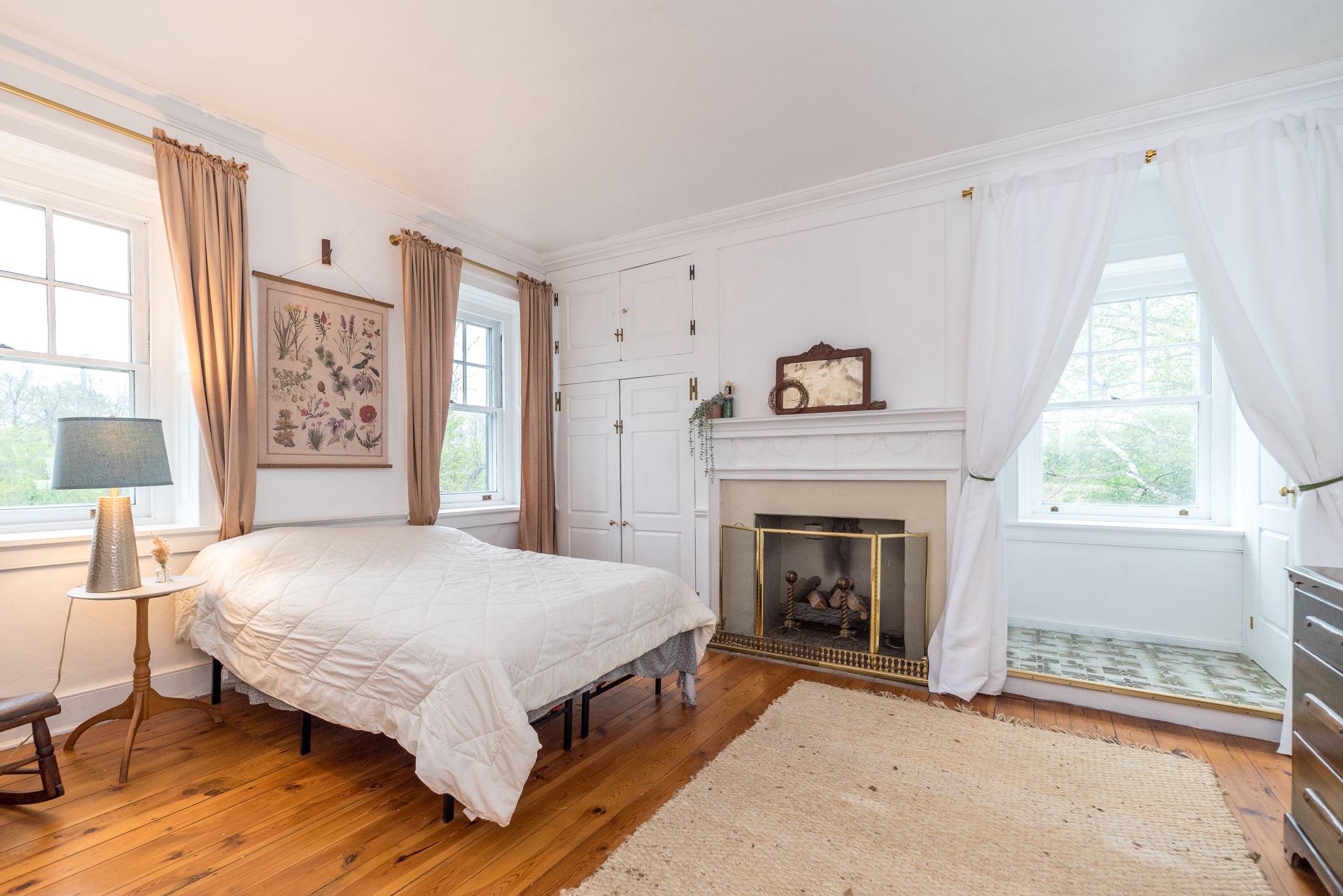 866 Schuylkill Road Birdsboro, PA 19508 - Photo 37 of 73 a bedroom with a bed and a fireplace