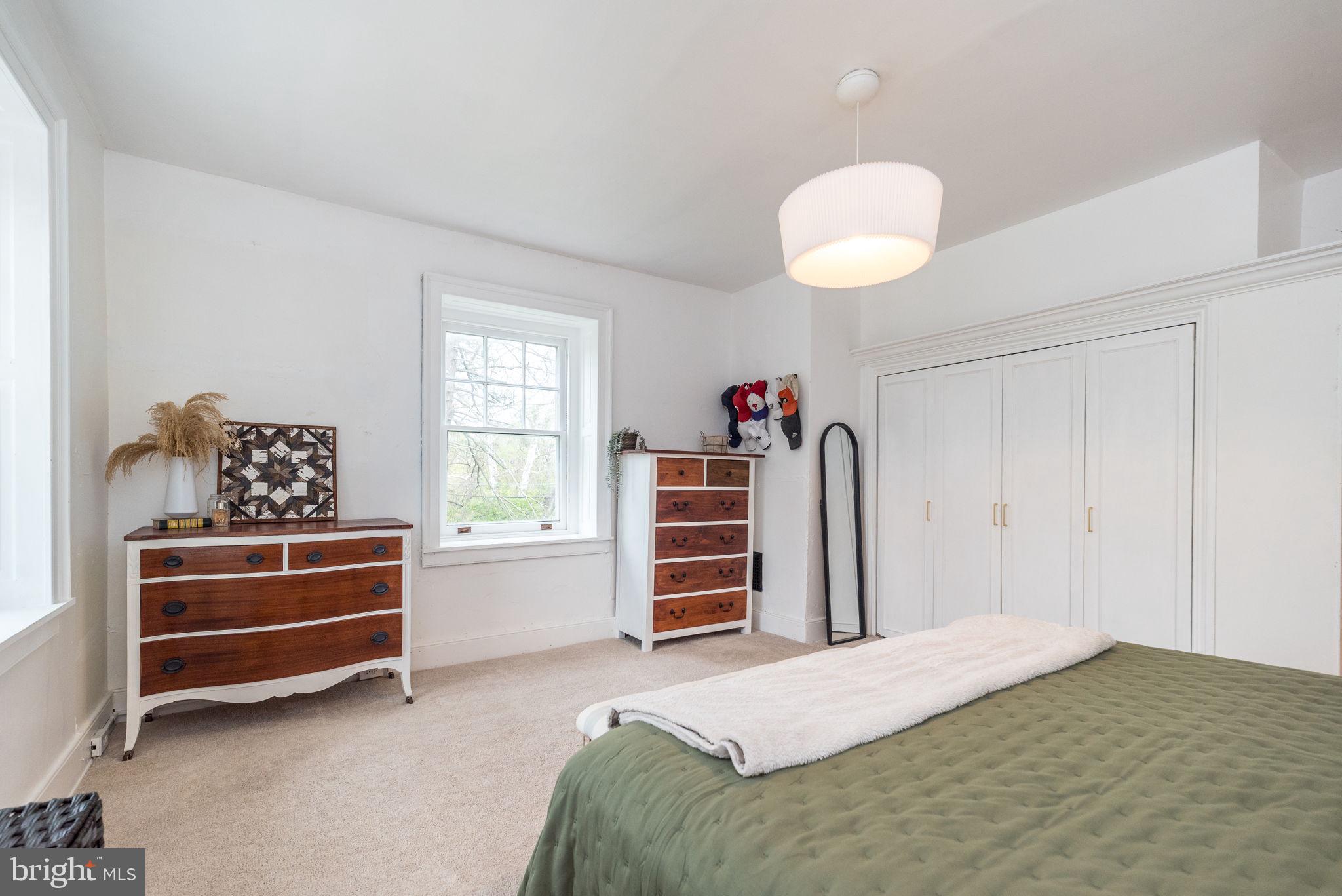 866 Schuylkill Road Birdsboro, PA 19508 - Photo 45 of 73 a bedroom with a bed and a chandelier